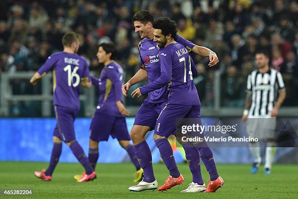 Mohamed Salah of ACF Fiorentina celebrates the opening goal with team mate Mario Gomez during the TIM Cup match between Juventus FC and ACF...