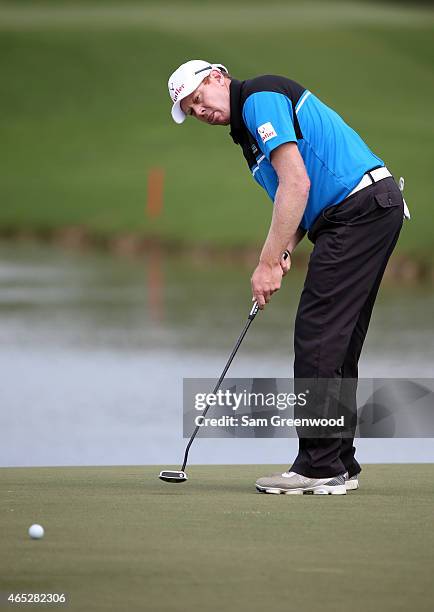 Steven Jeffress of Australia putts on the fourth green during the first round of the World Golf Championships-Cadillac Championship at Trump National...