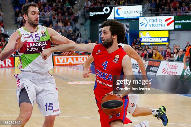 Milos Teodosic, #4 of CSKA Moscow competes with Mirza Begic, #15 of Laboral Kutxa Vitoria during the Turkish Airlines Euroleague Basketball Top 16...