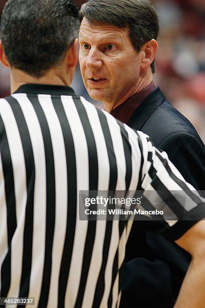 Head coach Ken Bone of the Washington State Cougars speaks with an official during a timeout in the first half against the Oregon Ducks at Beasley...