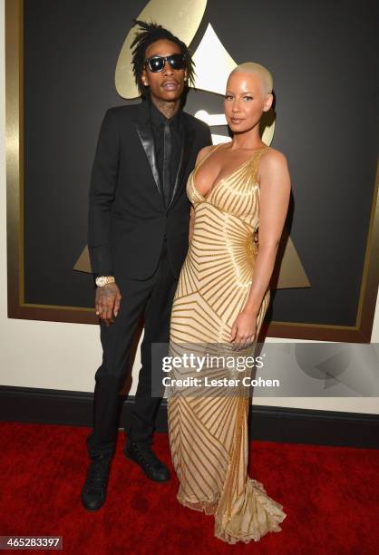 Recording artist Wiz Khalifa featured wearing Converse in support of the GRAMMY Foundation's GRAMMY Camp and model Amber Rose attend the 56th GRAMMY...