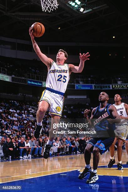 Mark Price of the Golden State Warriors shoots against Terrell Brandon of the Cleveland Cavaliers on March 13, 1997 at The Arena in Oakland,...