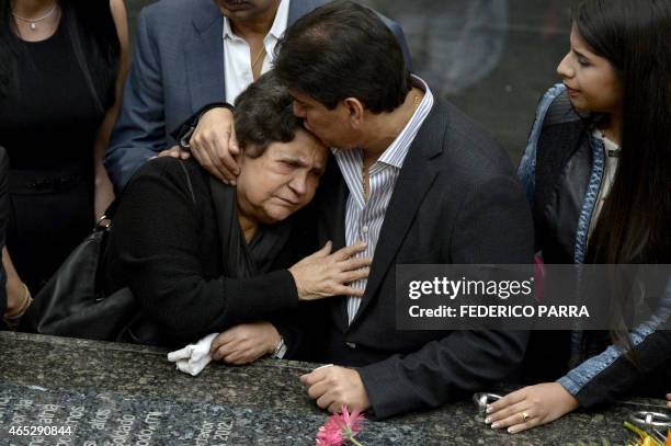 The mother of late President Hugo Chavez, Elena Frias , reacts by his tomb, during a ceremony for the second anniversary of his demise at the Cuartel...