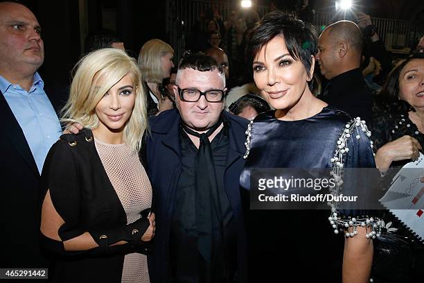 Fashion Designer Alber Elbaz pose between Kim Kardashian and her mother Kris Jenner after the Lanvin show as part of the Paris Fashion Week...