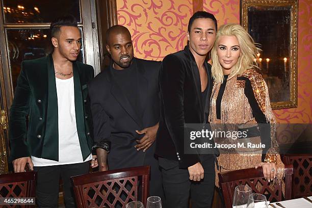 Lewis Hamilton, Kanye West, Olivier Rousteing and Kim Kardashian attend the Balmain Aftershow Dinner as part of the Paris Fashion Week Womenswear...