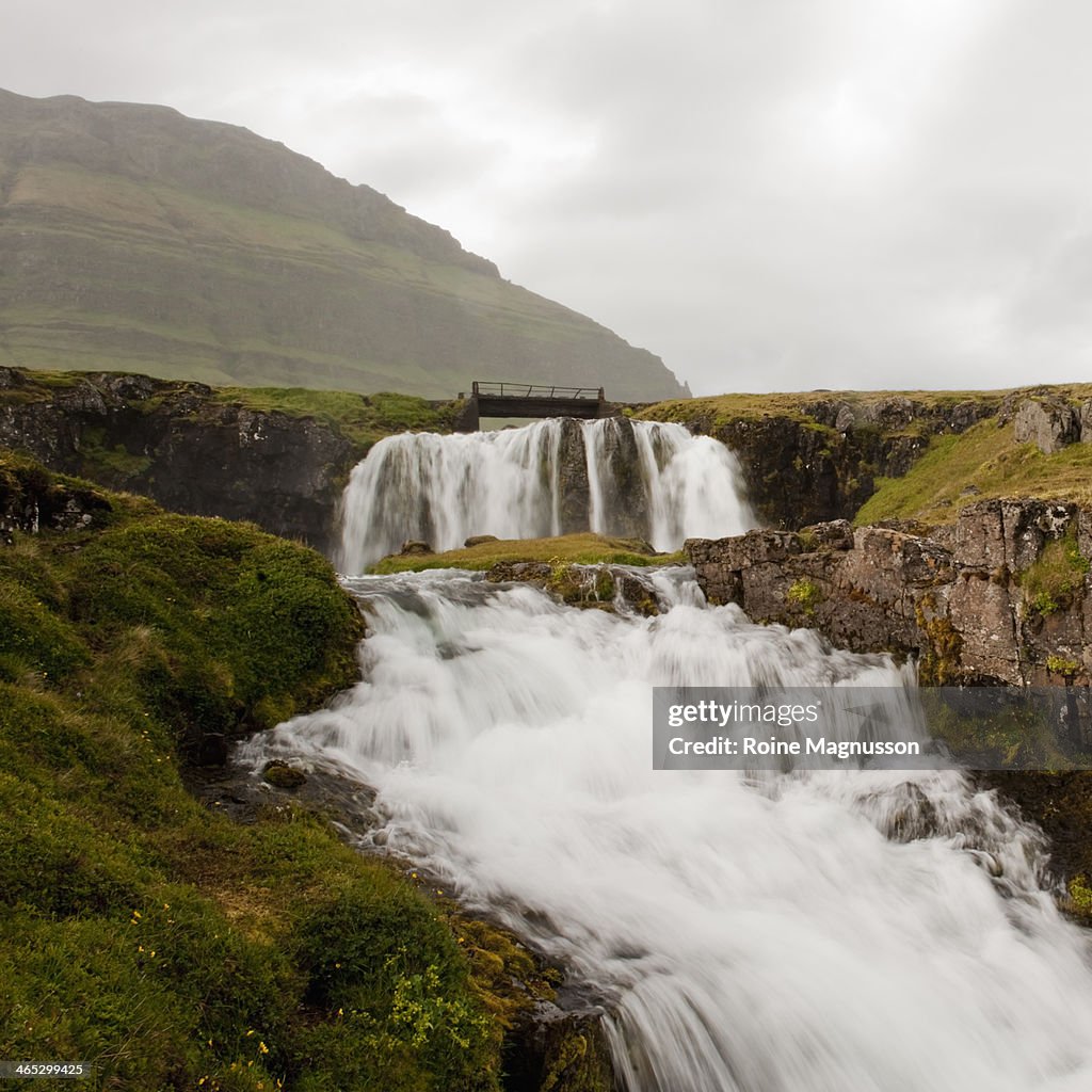 Waterfall in mountain landscape