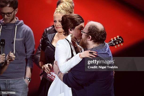 Singer Ann Sophie and singer Andreas Kuemmert react during the finals of the TV show 'Our Star For Austria' on March 5, 2015 in Hanover, Germany....