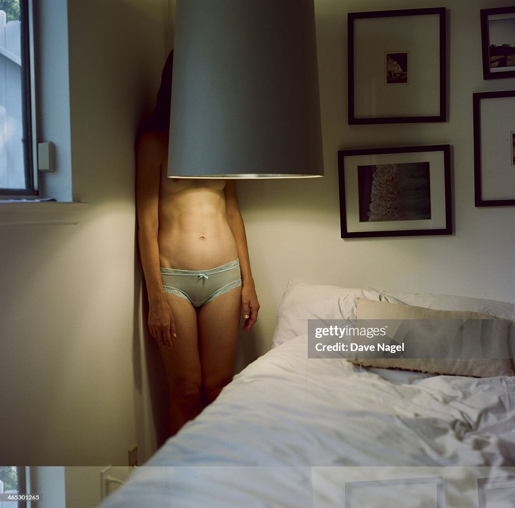 Woman behind lamp