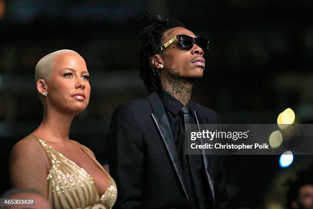 Recording artist Wiz Khalifa featured wearing Converse in support of the GRAMMY Foundation's GRAMMY Camp and model Amber Rose attends the 56th GRAMMY...