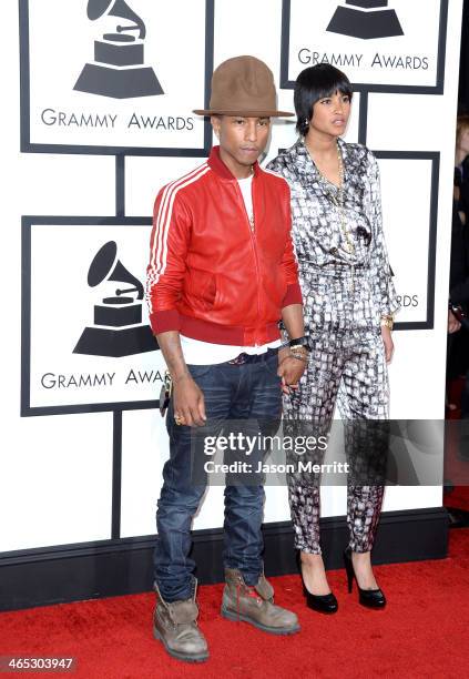 Recording artist Pharrell Williams and Helen Lasichanh attend the 56th GRAMMY Awards at Staples Center on January 26, 2014 in Los Angeles, California.