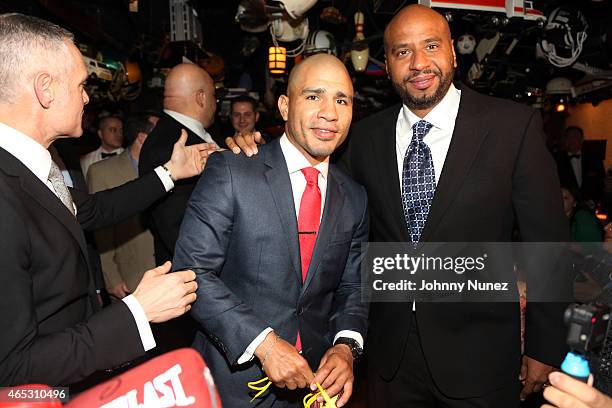 Michael Yormark, Miguel Cotto, and "OG" Juan Perez attend the announcement of Miguel Cotto's partnership with Roc Nation Sports at 21 Club on March 5...