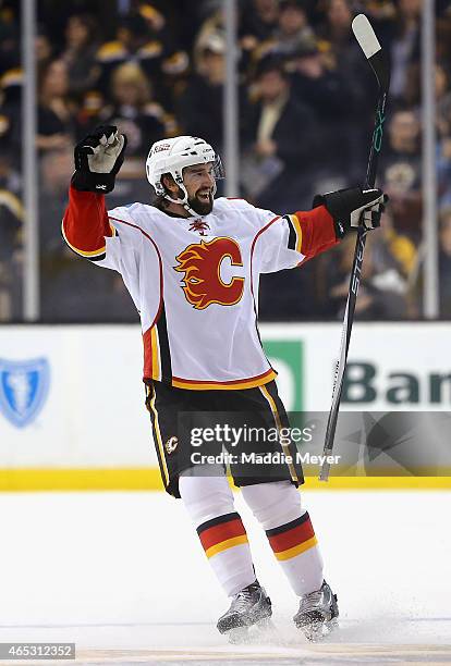 David Schlemko of the Calgary Flames is celebrates after scoring the game winning goal during a shootout against the Boston Bruins at TD Garden on...