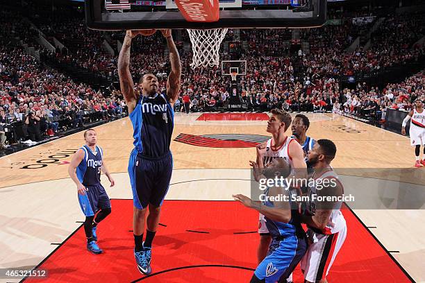 Greg Smith of the Dallas Mavericks grabs a rebound against the Portland Trail Blazers on March 5, 2015 at the Moda Center Arena in Portland, Oregon....