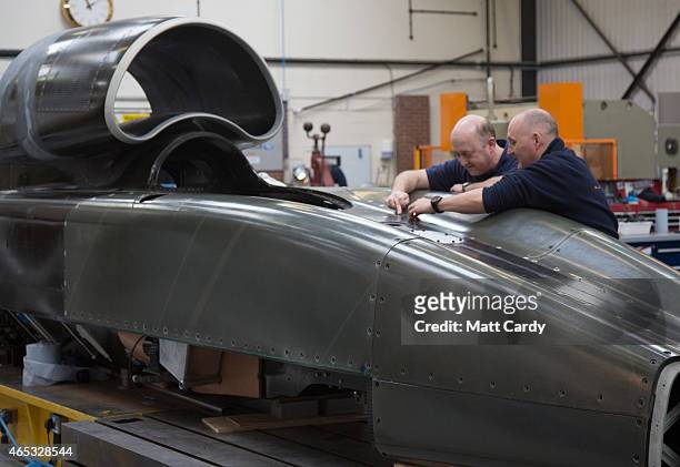 Engineers work on the carbon-fibre body of the Bloodhound SSC vehicle currently taking shape at its design centre in Avonmouth on March 5, 2015 in...