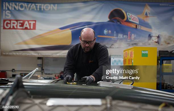 Engineer works on a carbon-fibre body panel of the Bloodhound SSC vehicle currently taking shape at its design centre in Avonmouth on March 5, 2015...