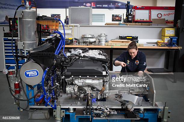 Cpl Kayleigh Williams from the Royal Electrical and Mechanical Engineers checks a Range Rover engine that will be also used in the Bloodhound SSC...