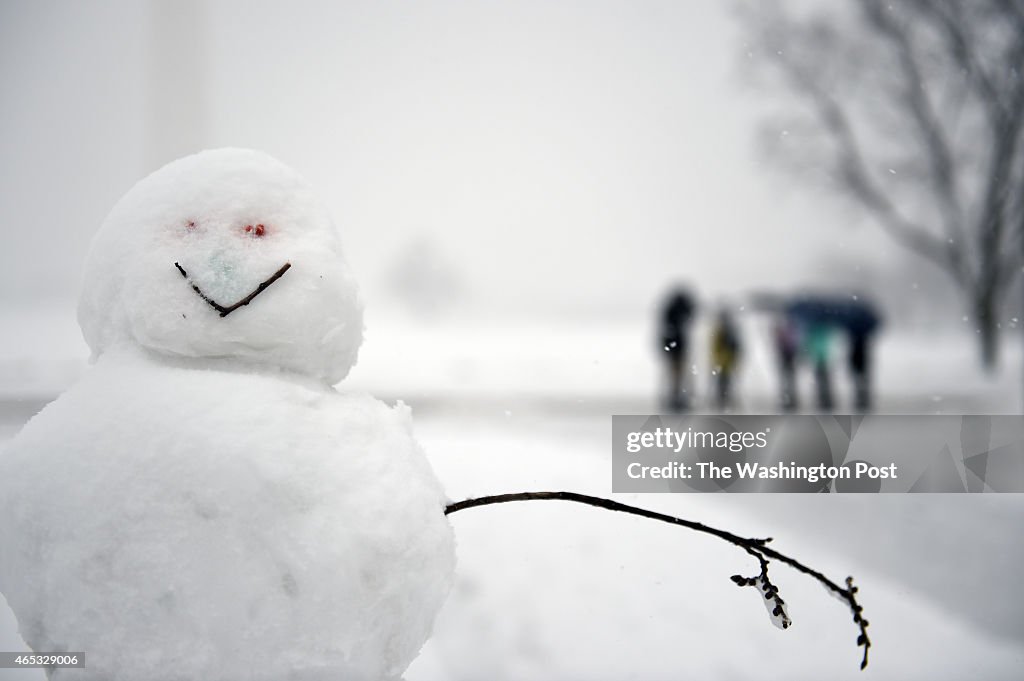 WASHINGTON, DC - MARCH 5: A snow man stands near the Washington