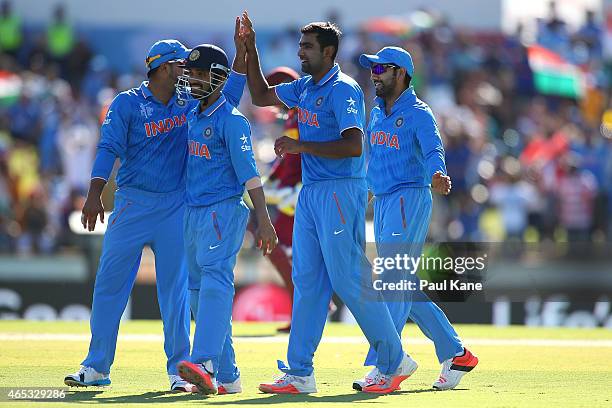 Ravichandran Ashwin of India celebrates the wicket of Jonathan Carter of the West Indies during the 2015 ICC Cricket World Cup match between India...