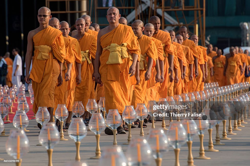 Monks from Dhammakaya temple's walk to a mass meditation...