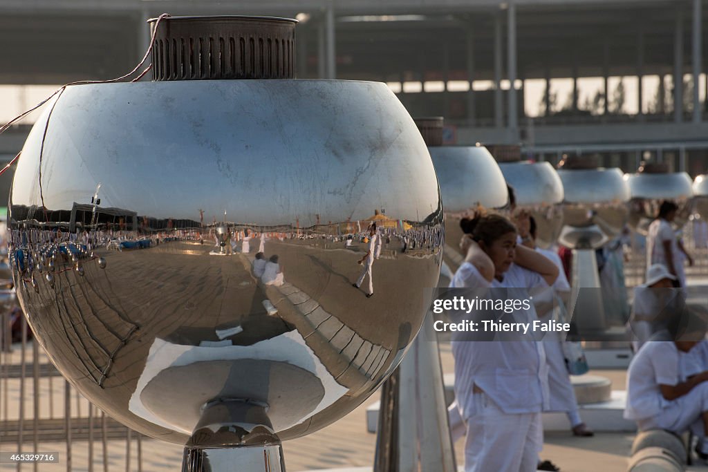 Large spherical torches waiting to be lightedare aligned at...