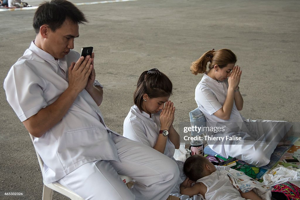 Dhammakaya temple's members pray during Magha Puja day, one...