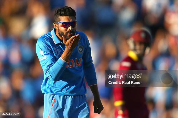 Ravindra Jadeja of India blows a kiss after dismissing Jason Holder of the West Indies during the 2015 ICC Cricket World Cup match between India and...