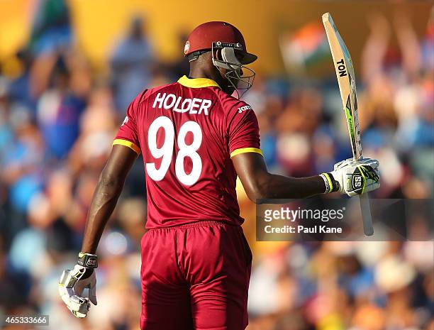 Jason Holder of the West Indies celebrates his half century during the 2015 ICC Cricket World Cup match between India and the West Indies at WACA on...