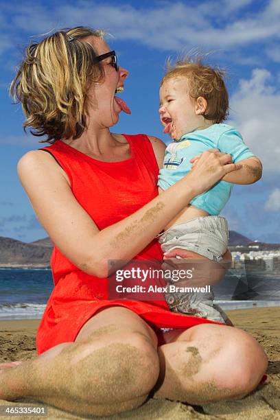boy on canteras beach - funny face baby stock pictures, royalty-free photos & images