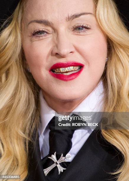 Madonna arrives on the red carpet for the 56th Grammy Awards at the Staples Center in Los Angeles, California, January 26, 2014. AFP PHOTO ROBYN BECK