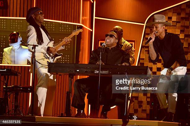 Daft Punk's Guy-Manuel de Homem-Christo, musician Nile Rodgers, and recording artists Pharrell Williams and Stevie Wonder perform onstage during the...