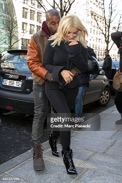 Kim Kardashian West and Kanye West are seen on March 6, 2015 in Paris, France.