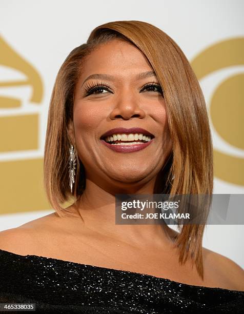 Queen Latifa poses in the press room during the 56th Grammy Awards at the Staples Center in Los Angeles, California, January 26, 2014. AFP PHOTO /...