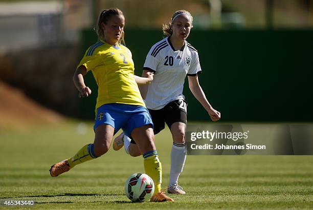 Ronja Aronsson of Sweden and Pia-Sophie Wolter of Germany fight for the ball during the women's U19 international friendly match between Sweden and...