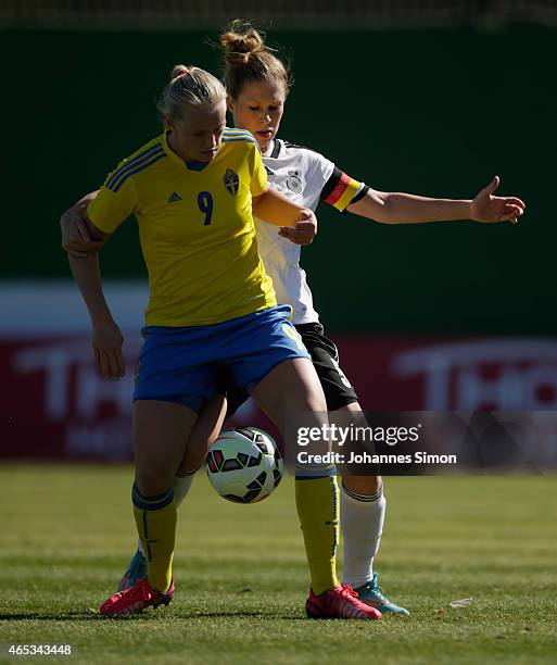 Stina Blackstenius of Sweden and Rebecca Knaak of Germany fight for the ball during the women's U19 international friendly match between Sweden and...
