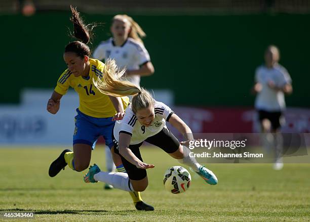 Anna Oskarsson of Sweden and Nina Ehegoetz of Germany fight for the ball during the women's U19 international friendly match between Sweden and...