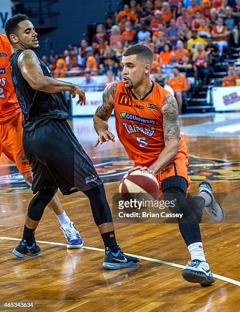 Cairns' Scottie Wilbekin rounds the New Zealand defence during game one of the 2015 NBL Grand Final series between the Cairns Taipans and the New...