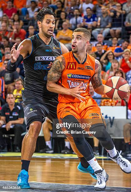 Cairns' Scottie Wilbekin rounds New Zealand's defence during game one of the 2015 NBL Grand Final series between the Cairns Taipans and the New...