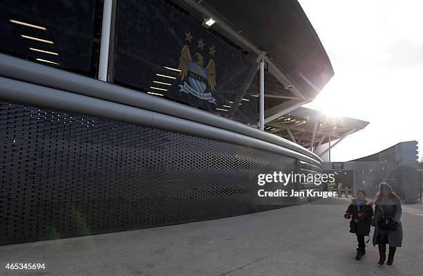 Fans make their way to the stadium during the UEFA Youth League Round of 16 match between Manchester City FC and FC Schalke 04 at City Football...