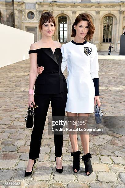 Actress Dakota Johnson and Hanneli Mustaparta attend the Christian Dior show as part of the Paris Fashion Week Womenswear Fall/Winter 2015/2016 on...
