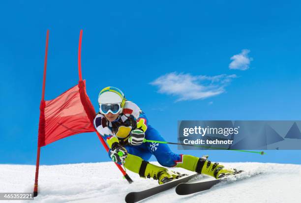 professional female ski competitor at giant slalom race - ski slalom stock pictures, royalty-free photos & images