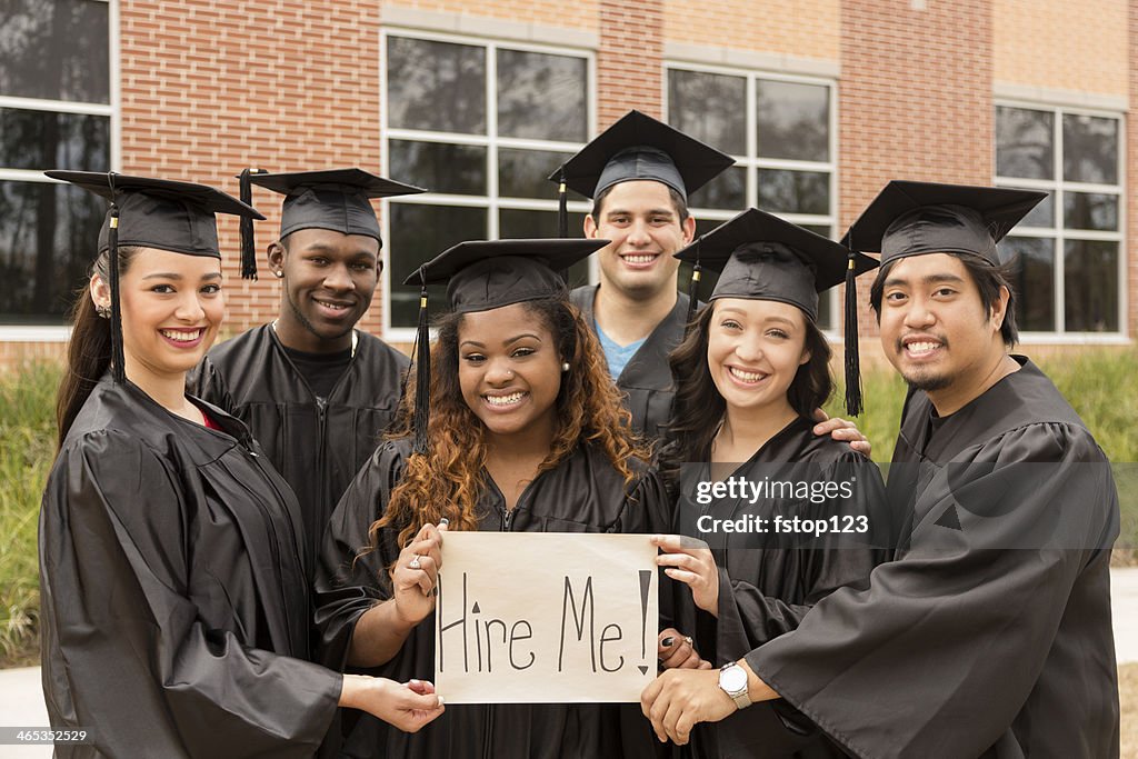 Education: Friends hold 'Hire Me' sign after college graduation.