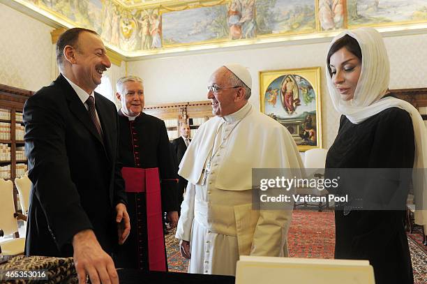 Pope Francis exchanges gifts with President of Azerbaijan Ilham Aliyev and his wife Mehriban Aliyeva at his private library in the Apostolic Palace...