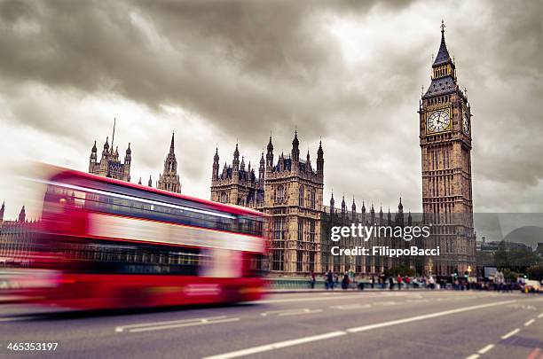 motion blurred image of double decker bus driving to big ben - london bus big ben stock pictures, royalty-free photos & images