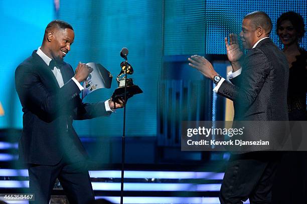 Actor Jamie Foxx presents Rapper Jay Z the Best Rap/Sung Collaboration award for 'Holy Grail' onstage during the 56th GRAMMY Awards at Staples Center...