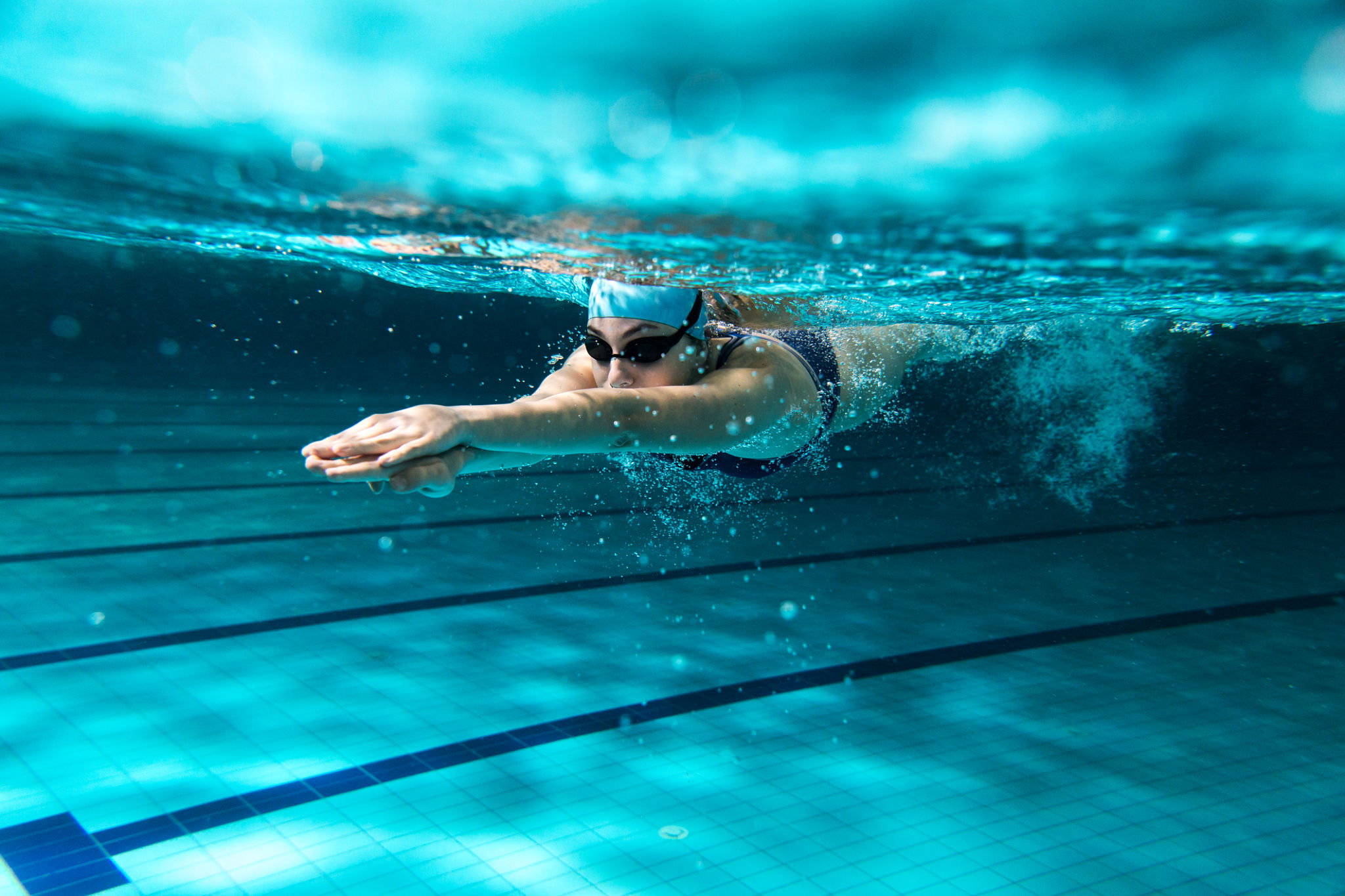 Female swimmer at the swimming pool. Female swimmer at the swimming pool.