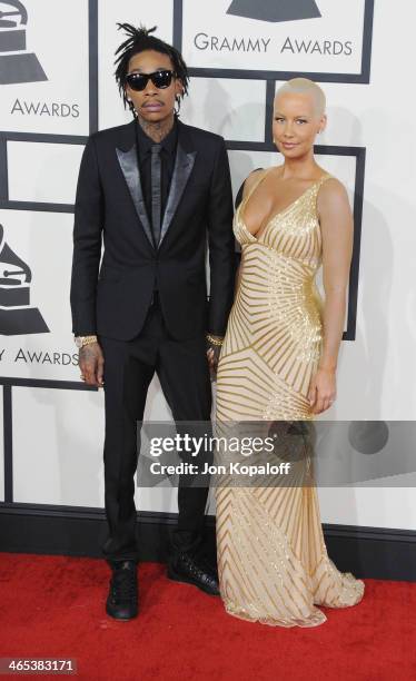Singer Wiz Khalifa and wife model Amber Rose arrive at the 56th GRAMMY Awards at Staples Center on January 26, 2014 in Los Angeles, California.