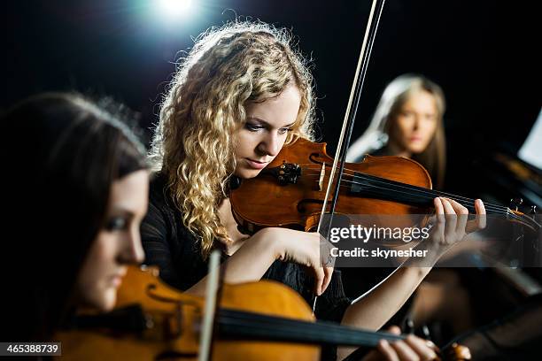 trio female orchestra. - snaarinstrument stockfoto's en -beelden