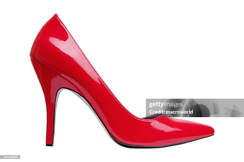 A bright red high heel woman's shoe by itself 