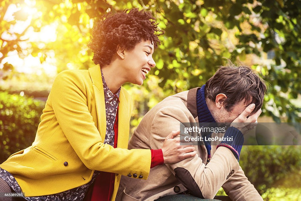Couple joking in the park