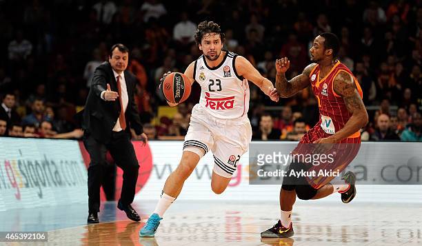 Sergio Llull, #23 of Real Madrid competes with Justin Carter, #1 of Galatasaray Liv Hospital Istanbul during the Turkish Airlines Euroleague...